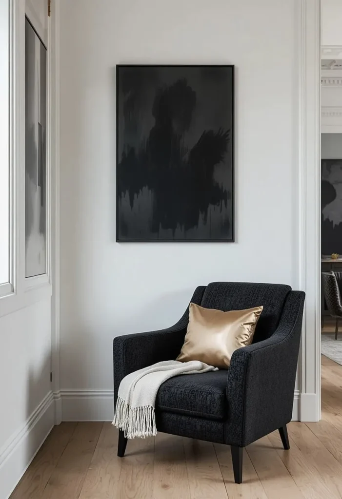 Matte black boucle accent chair with gold cushions in a dramatic modern white living room"
